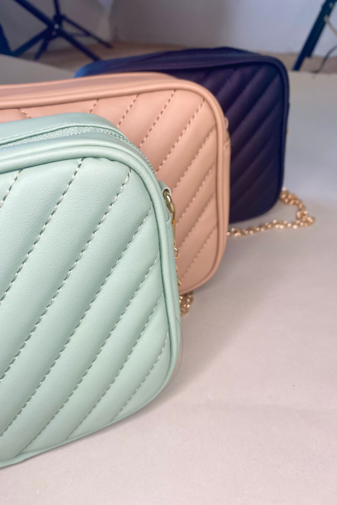 set of three mini quilted pattern purses with gold chain straps in black, mint green, and beige