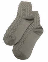 Pair of gray socks with textured pattern on a white background