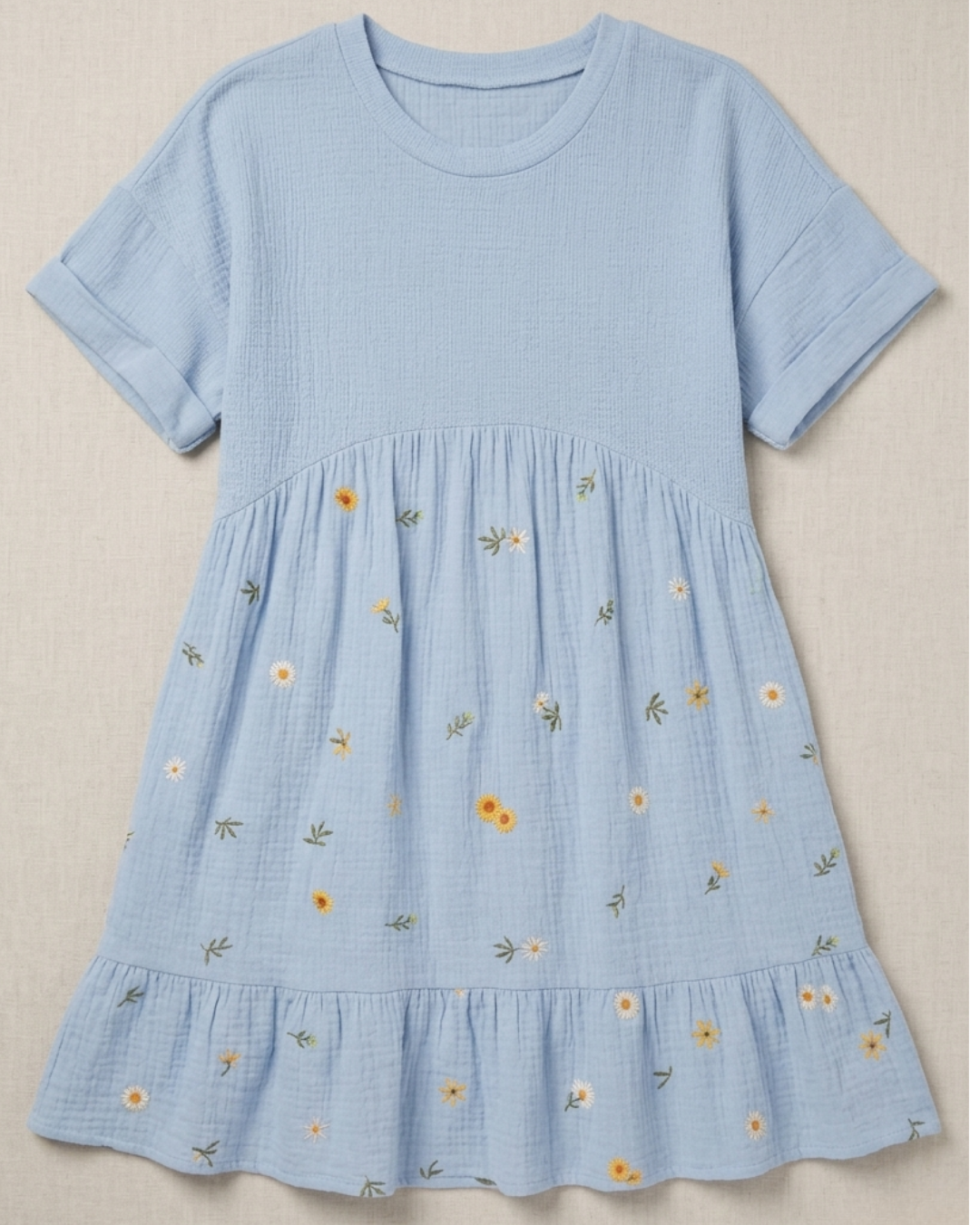 Light blue dress with floral patterns on a beige background