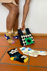 trendy printed daisy socks in three different colors, sage, black and beige
