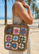model is wearing crochet tote bag