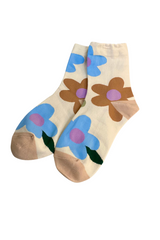 woman's patterned colorful daisy aesthetic socks 